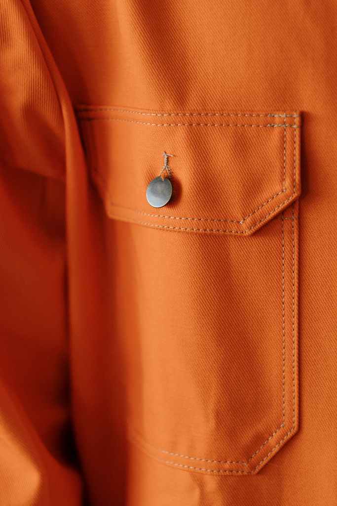 Close-up of orange overalls